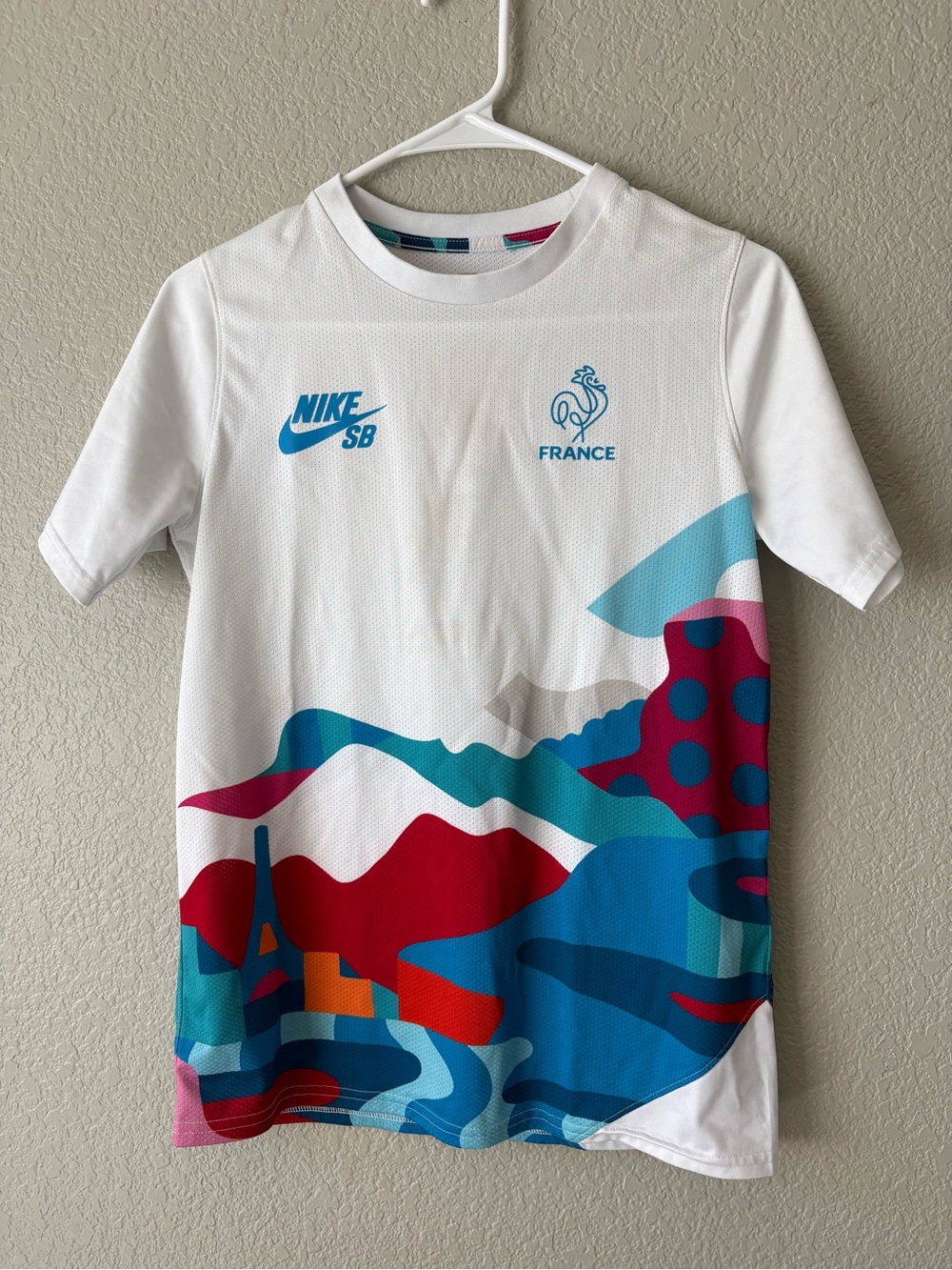 Nike Kids White Tee with Blue & Red Graphic